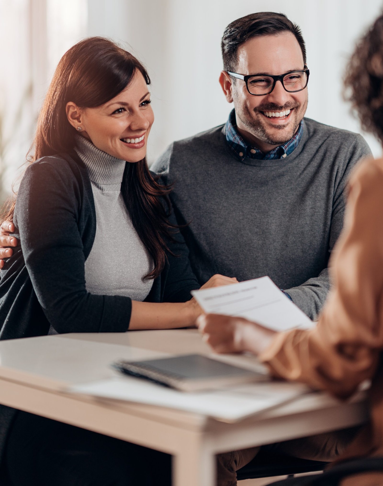 Travel agent talking with clients New Jersey Tax Relief